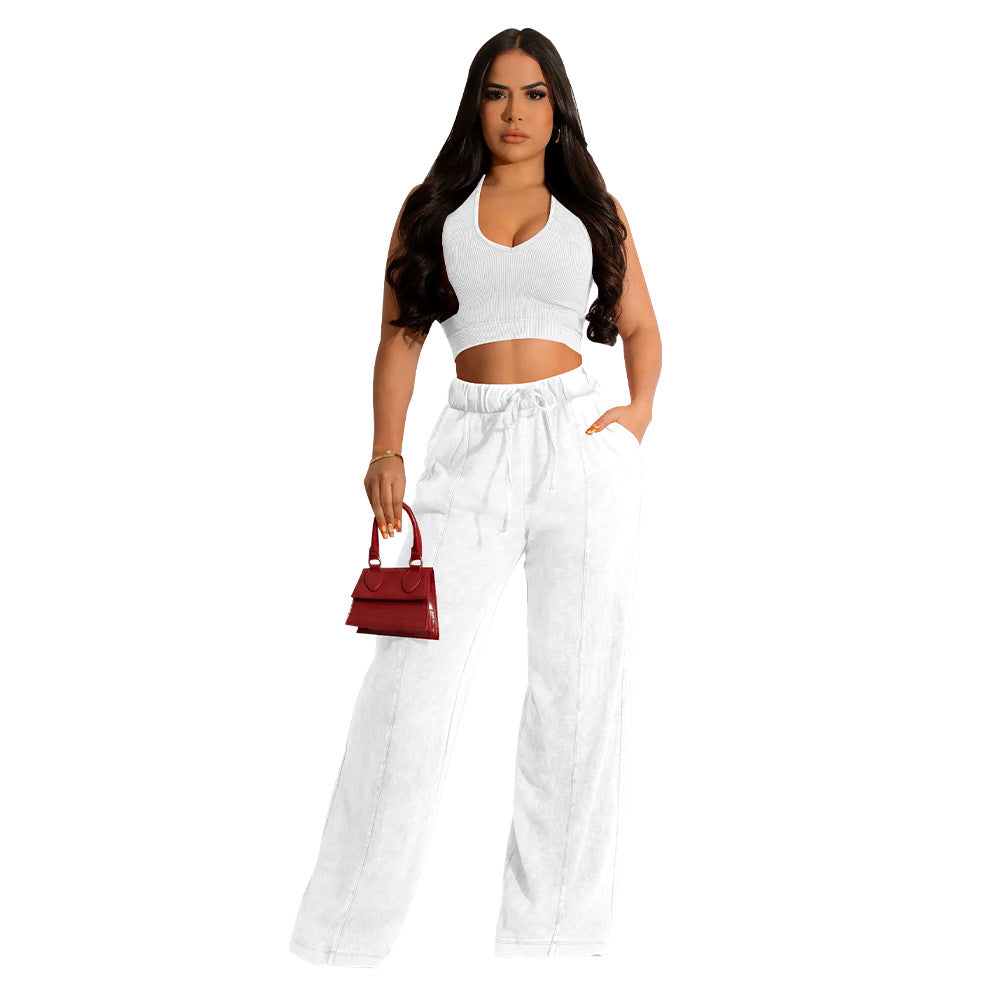 Conjunto de dos piezas de camiseta sin mangas y pantalones anchos de color liso para mujer
