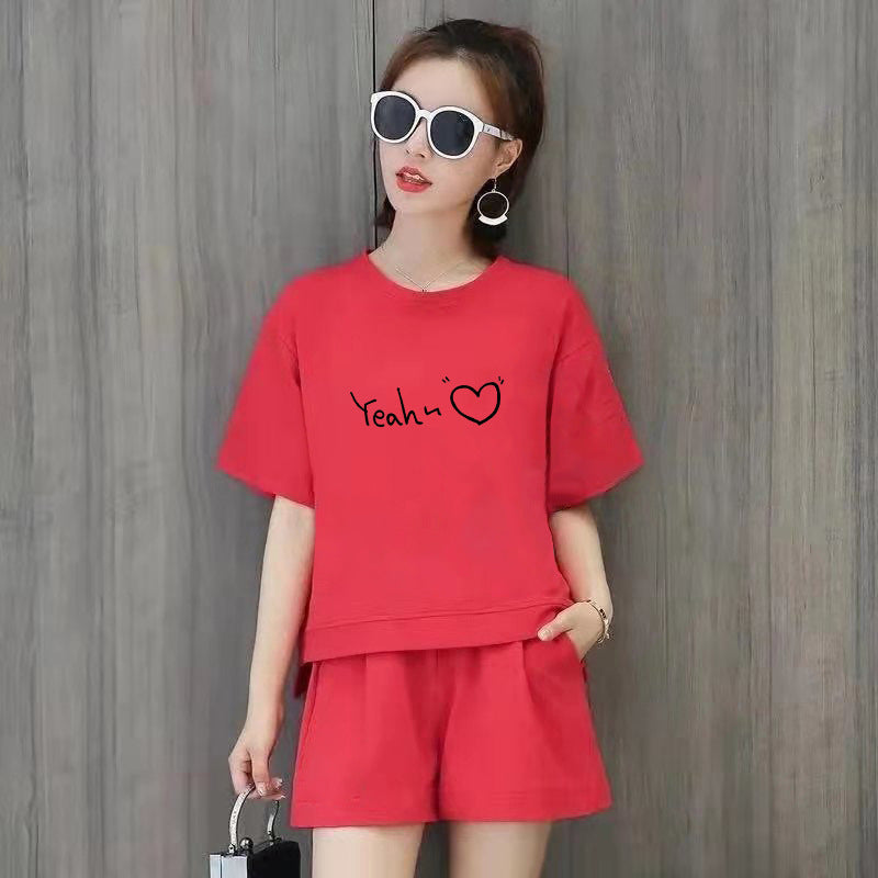 Conjunto de 2 piezas de camiseta de manga corta con cuello redondo, pantalones cortos y cintura definida, estampado de color liso y holgado para mujer
