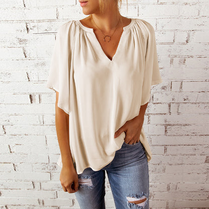 Blusa informal holgada de color liso con cuello en V y manga corta para mujer