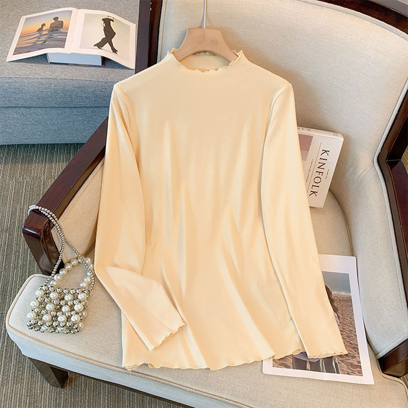 Camiseta básica informal holgada de talla grande con cuello alto y manga larga en color liso para mujer