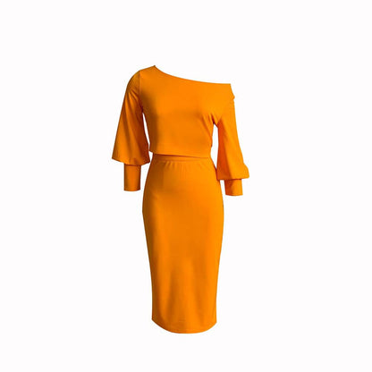 Conjunto de dos piezas formado por top y falda de cintura alta, manga larga, hombros descubiertos, color liso, informal, para mujer