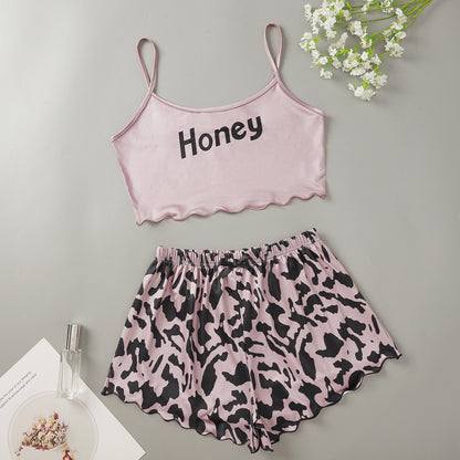 Conjunto de pijama informal atrevido con top corto sin mangas y pantalones cortos para mujer