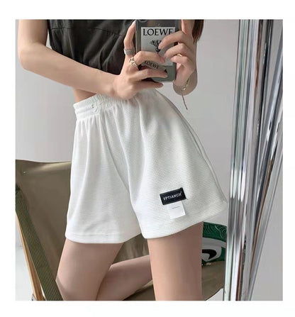 Pantalones cortos casuales de pierna ancha de color liso para mujer