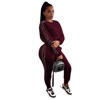 Conjunto de dos piezas de top y pantalones ajustados de manga larga con cuello redondo y diseño de cuentas informal para mujer