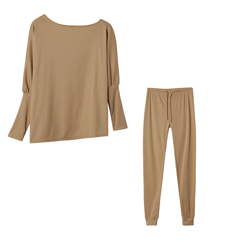 Conjunto de dos piezas formado por top y pantalón ajustado, manga larga, hombros descubiertos, color liso, informal, a la moda para mujer