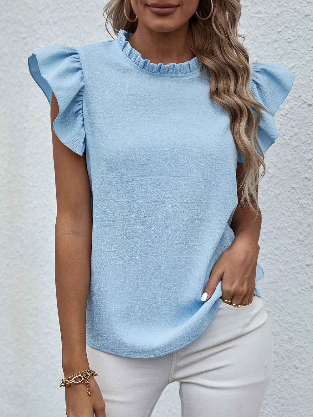 Blusa informal sin mangas con cuello redondo y volantes de color liso a la moda para mujer