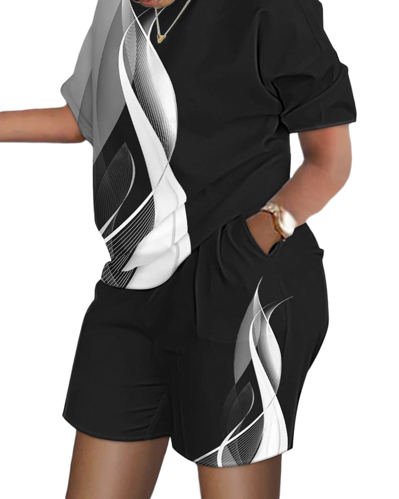 Conjunto de dos piezas de top y pantalones cortos de manga corta con cuello redondo y estampado gráfico informal para mujer