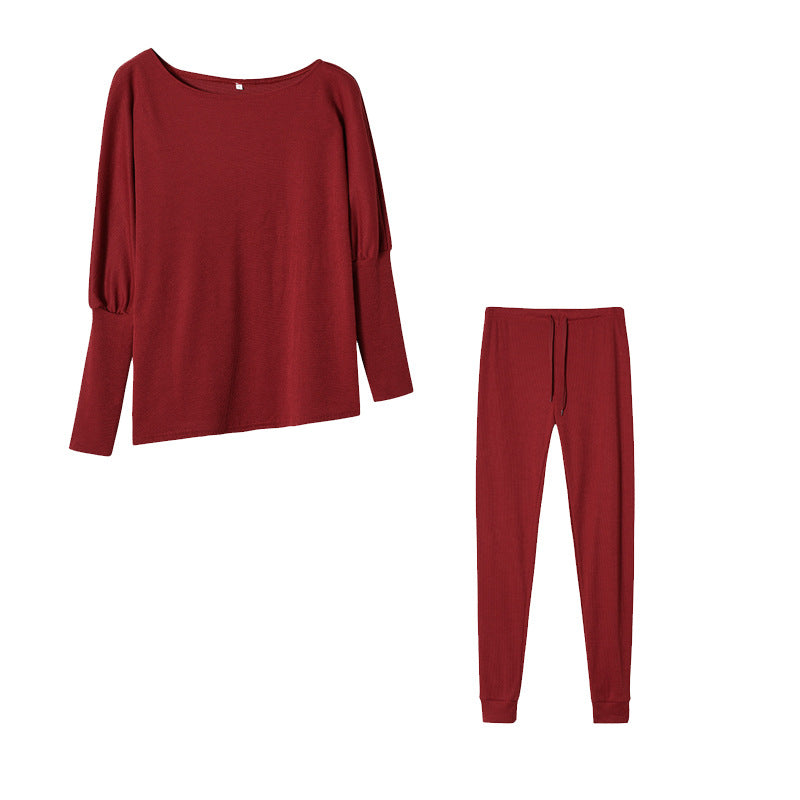 Conjunto de dos piezas formado por top y pantalón ajustado, manga larga, hombros descubiertos, color liso, informal, a la moda para mujer