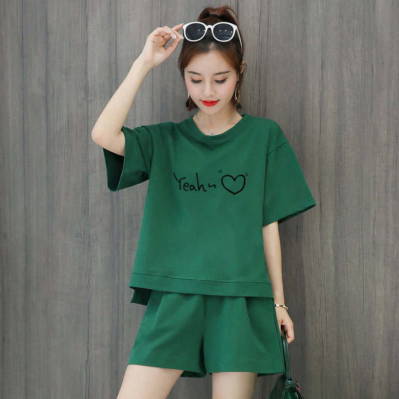Conjunto de 2 piezas de camiseta de manga corta con cuello redondo, pantalones cortos y cintura definida, estampado de color liso y holgado para mujer