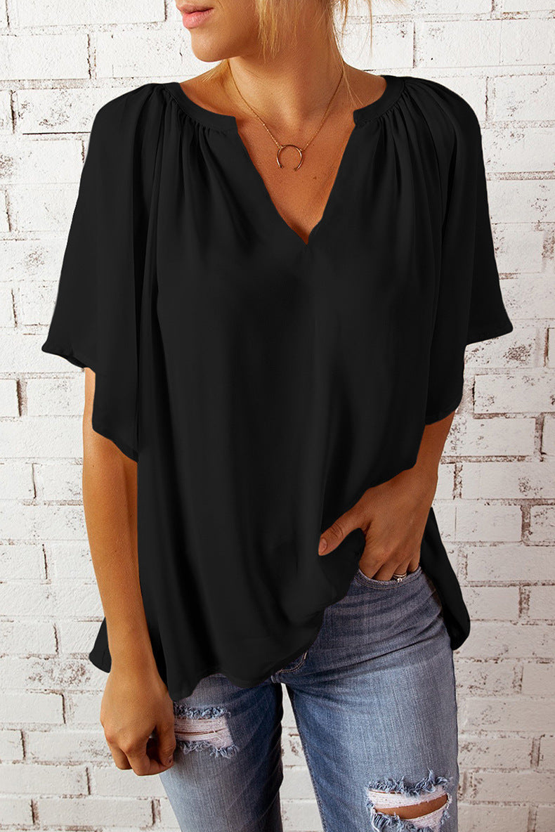 Blusa informal holgada de color liso con cuello en V y manga corta para mujer