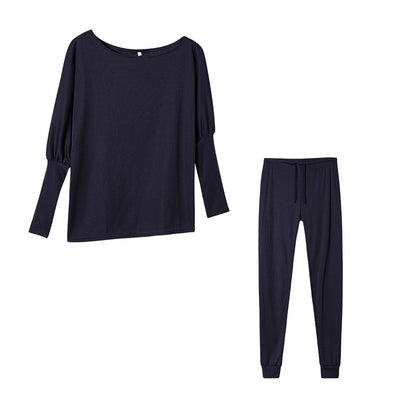 Conjunto de dos piezas formado por top y pantalón ajustado, manga larga, hombros descubiertos, color liso, informal, a la moda para mujer