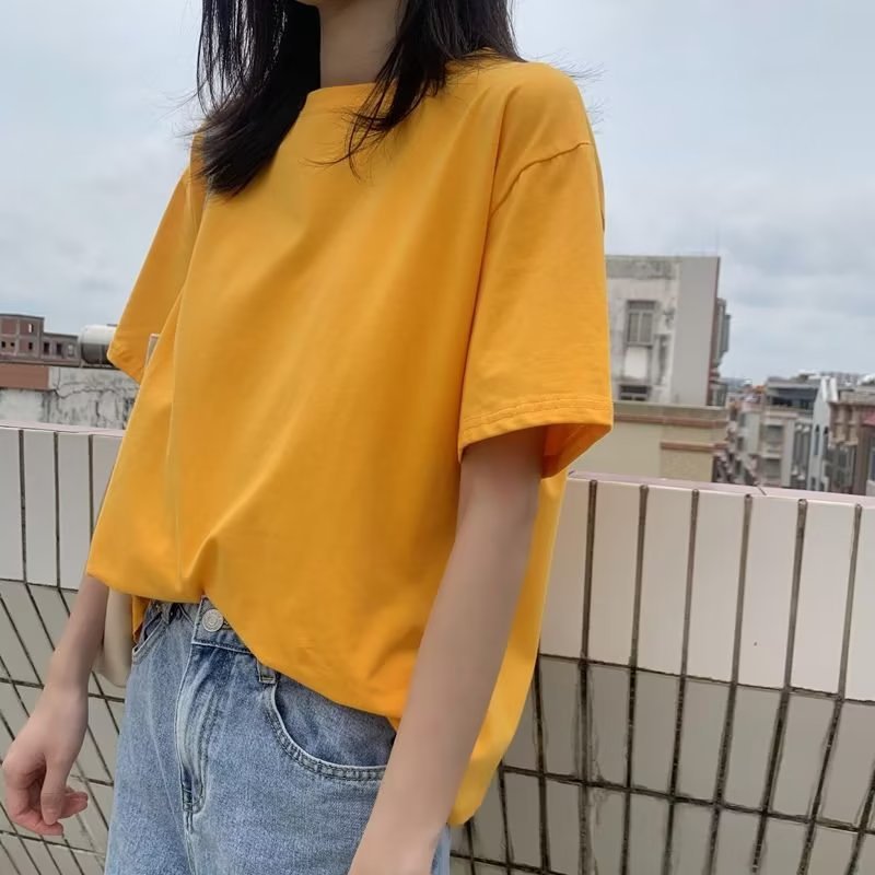 Camiseta básica holgada informal de color liso con cuello redondo para mujer