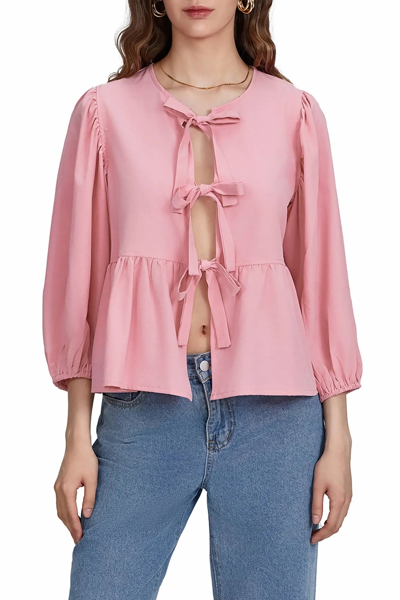 Blusa con mangas abullonadas, peplum y lazos