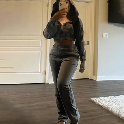 Conjunto de dos piezas de sudadera y pantalones ajustados con cremallera de color liso informal para mujer