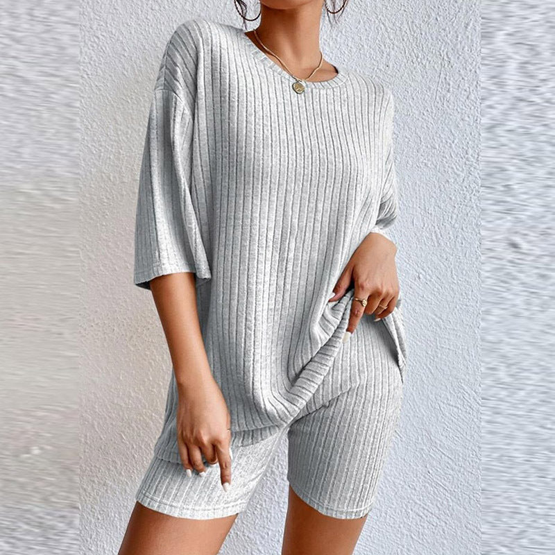 Conjunto de dos piezas de top y pantalones cortos de manga corta de punto acanalado de color liso informal para mujer