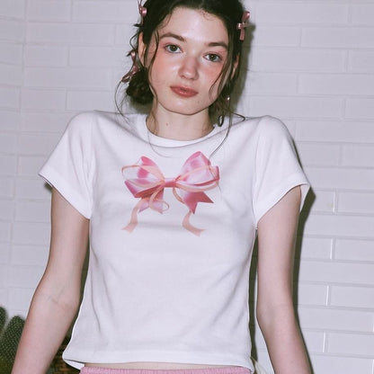 Camiseta informal de manga corta con cuello redondo y estampado de lazo de color liso para mujer