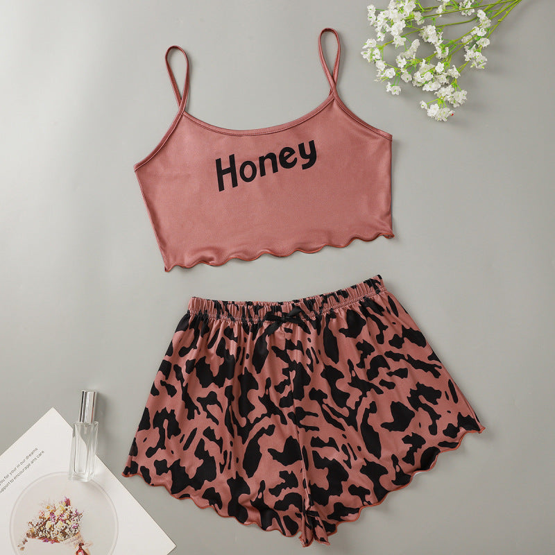 Conjunto de pijama informal atrevido con top corto sin mangas y pantalones cortos para mujer