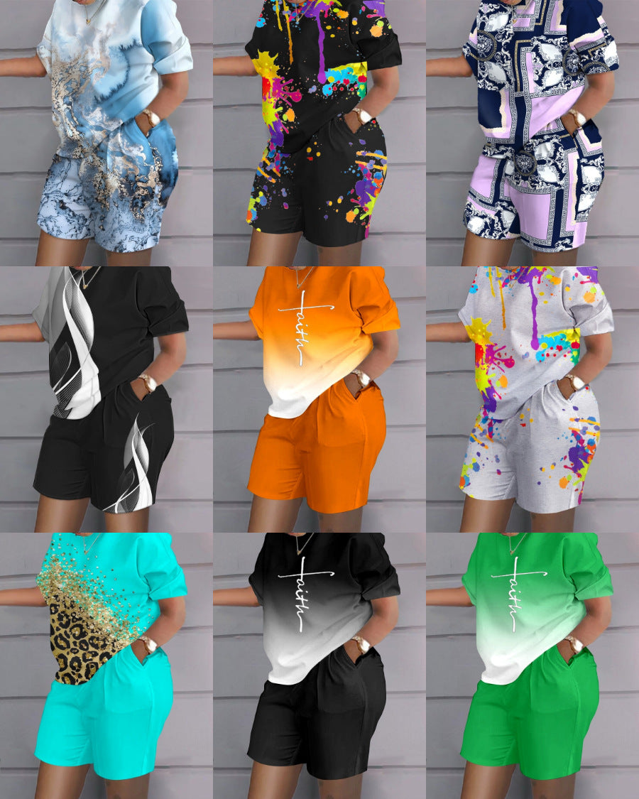 Conjunto de dos piezas de top y pantalones cortos de manga corta con cuello redondo y estampado gráfico informal para mujer
