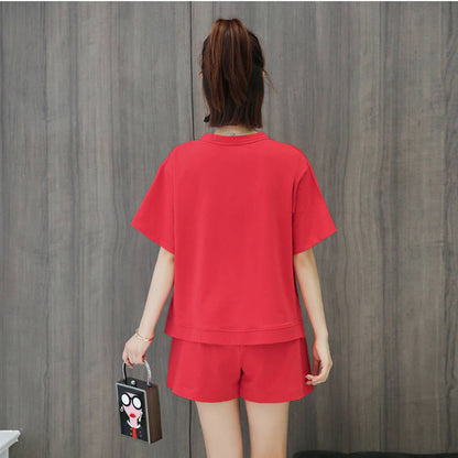 Conjunto de 2 piezas de camiseta de manga corta con cuello redondo, pantalones cortos y cintura definida, estampado de color liso y holgado para mujer