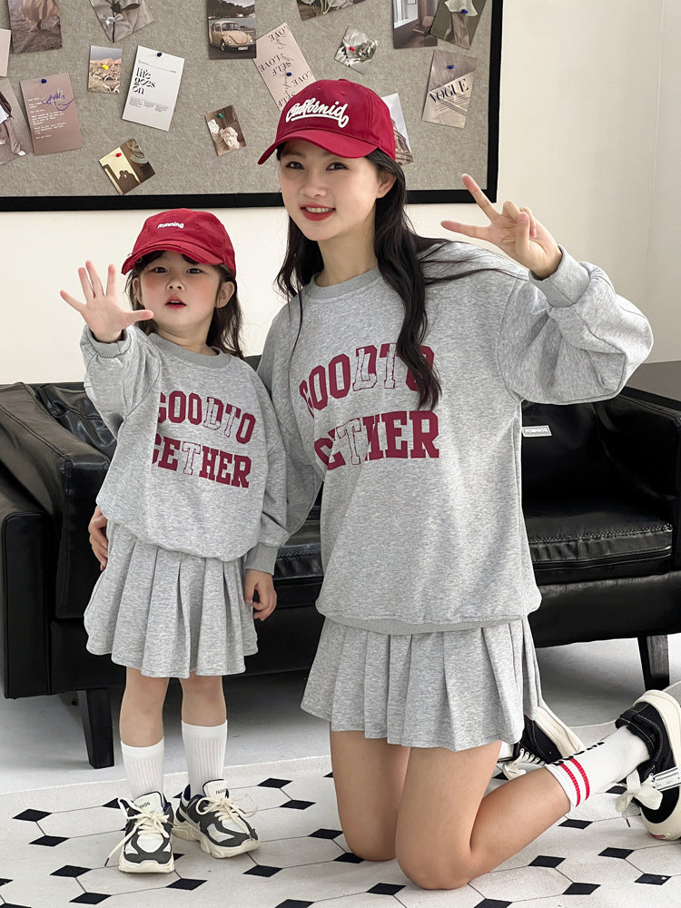 Conjunto de dos piezas de sudadera informal con estampado de letras y falda plisada para mujer