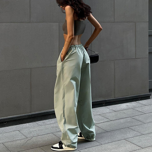 Pantalones casuales sueltos de cintura alta elásticos de color sólido para mujer