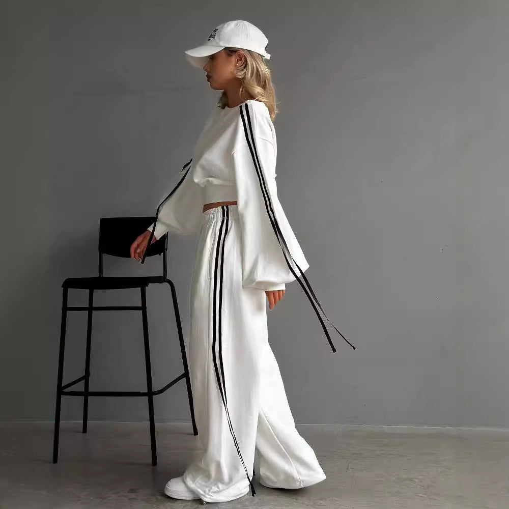 Conjunto de dos piezas de camiseta informal de rayas con hombros descubiertos, manga larga y pantalones con cordones y cintura alta para mujer