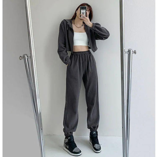Conjunto de dos piezas formado por top holgado de manga larga y pantalón informal de cintura alta elástica, color liso, para mujer