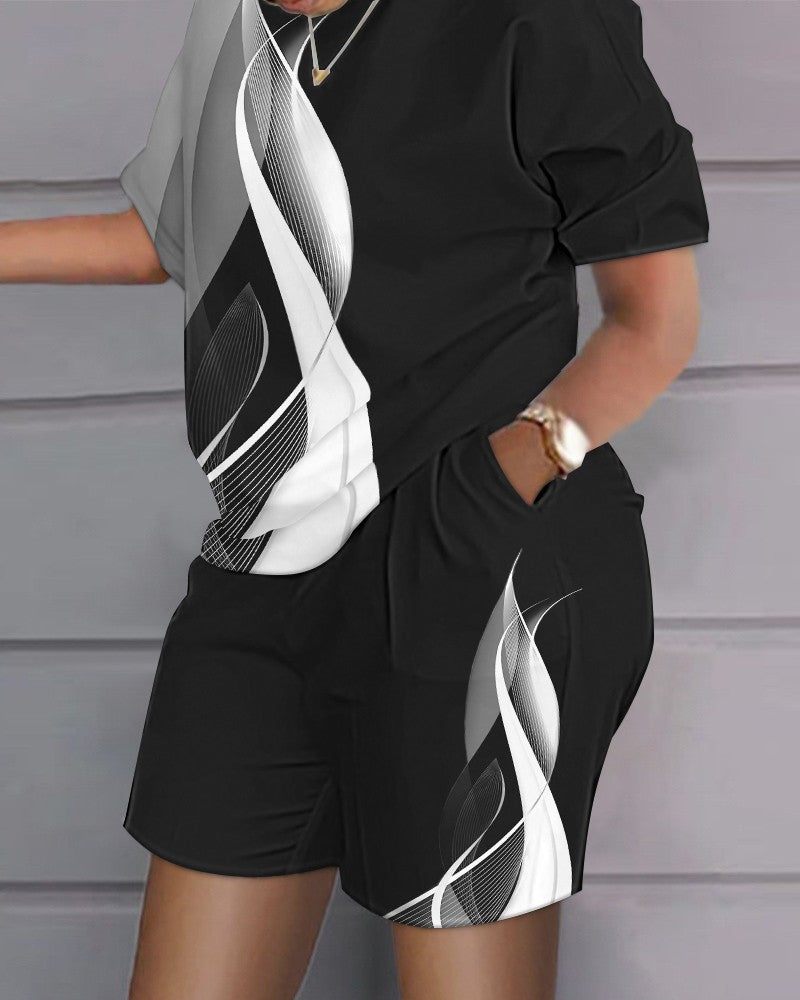 Conjunto de dos piezas de top y pantalones cortos de manga corta con cuello redondo y estampado gráfico informal para mujer