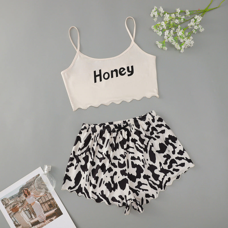 Conjunto de pijama informal atrevido con top corto sin mangas y pantalones cortos para mujer