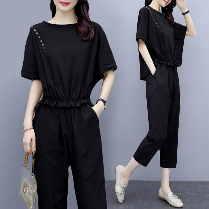 Conjunto de dos piezas formado por top y pantalón de manga corta y cuello redondo, informal, a la moda para mujer