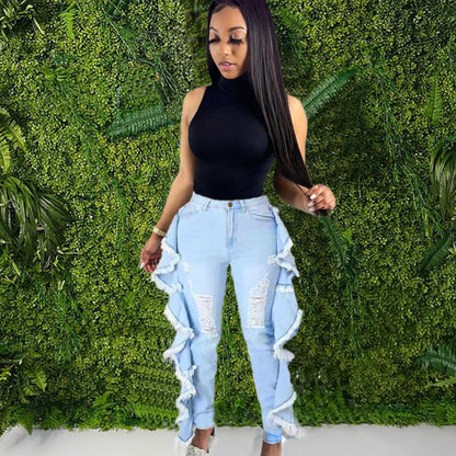 Vaqueros ajustados con borlas y volantes rotos para mujer