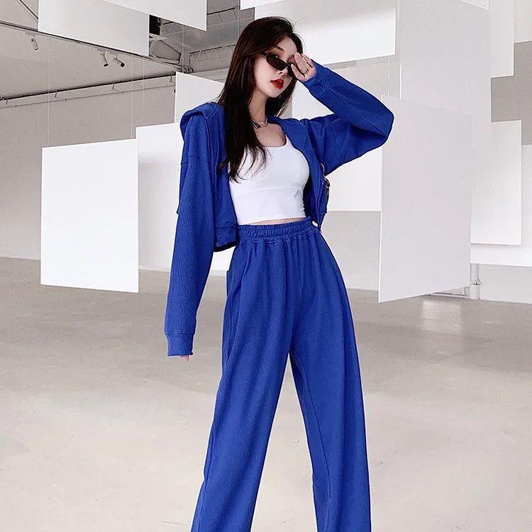 Conjunto de dos piezas formado por top holgado de manga larga y pantalón informal de cintura alta elástica, color liso, para mujer