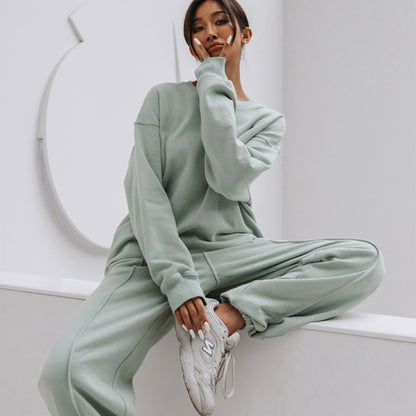 Conjunto de dos piezas holgado e informal con top y pantalón de manga larga y cuello redondo de color liso para mujer