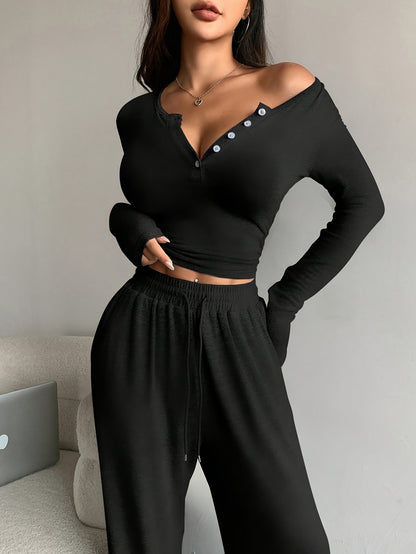 Conjunto de dos piezas de camiseta y pantalones holgados de manga larga ajustados de color liso para mujer
