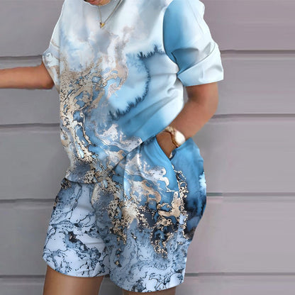 Conjunto de dos piezas de top y pantalones cortos de manga corta con cuello redondo y estampado gráfico informal para mujer