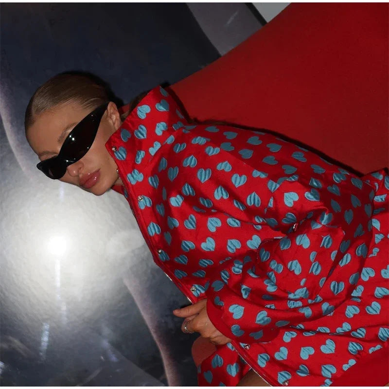 Conjunto de dos piezas formado por chaqueta, top y falda, manga larga, con cremallera y estampado de corazón, para mujer