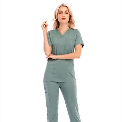 Conjunto de enfermera informal de color sólido con cuello en V, manga corta y bolsillo