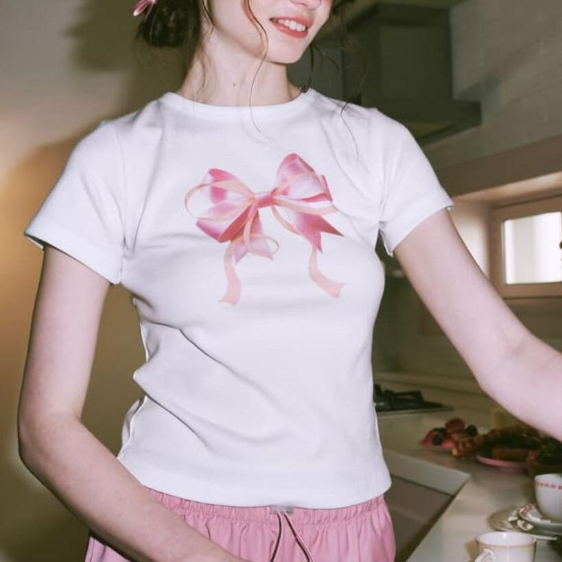 Camiseta informal de manga corta con cuello redondo y estampado de lazo de color liso para mujer