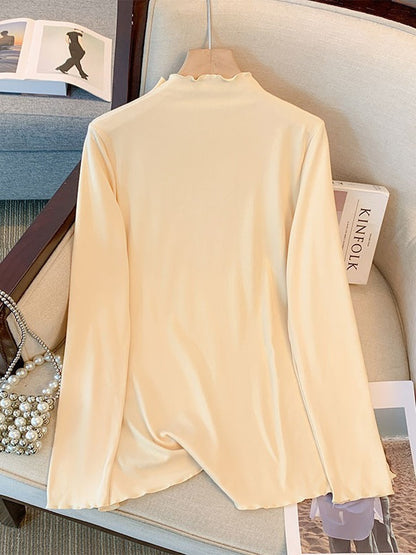 Camiseta básica informal holgada de talla grande con cuello alto y manga larga en color liso para mujer