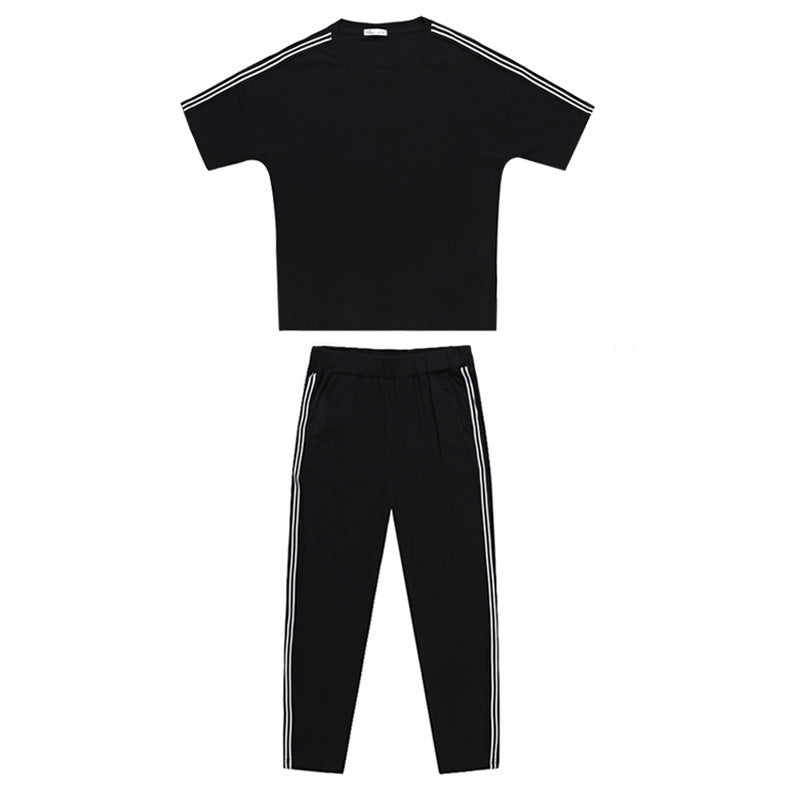 Conjunto de dos piezas de top y pantalón de manga corta con cuello redondo y rayas informales a la moda para mujer