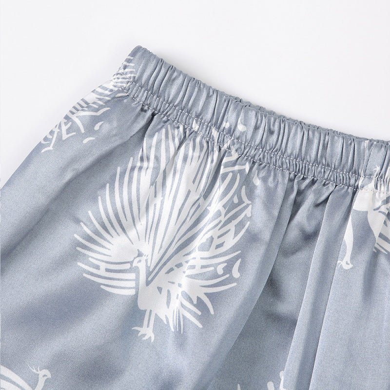 Conjunto de pijama informal de manga larga con solapa y estampado de plumas para mujer