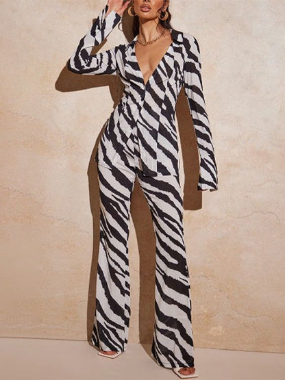 Conjunto de dos piezas de blusa holgada informal con escote en V profundo y botonadura sencilla para mujer, con pantalones anchos estampados sexys.