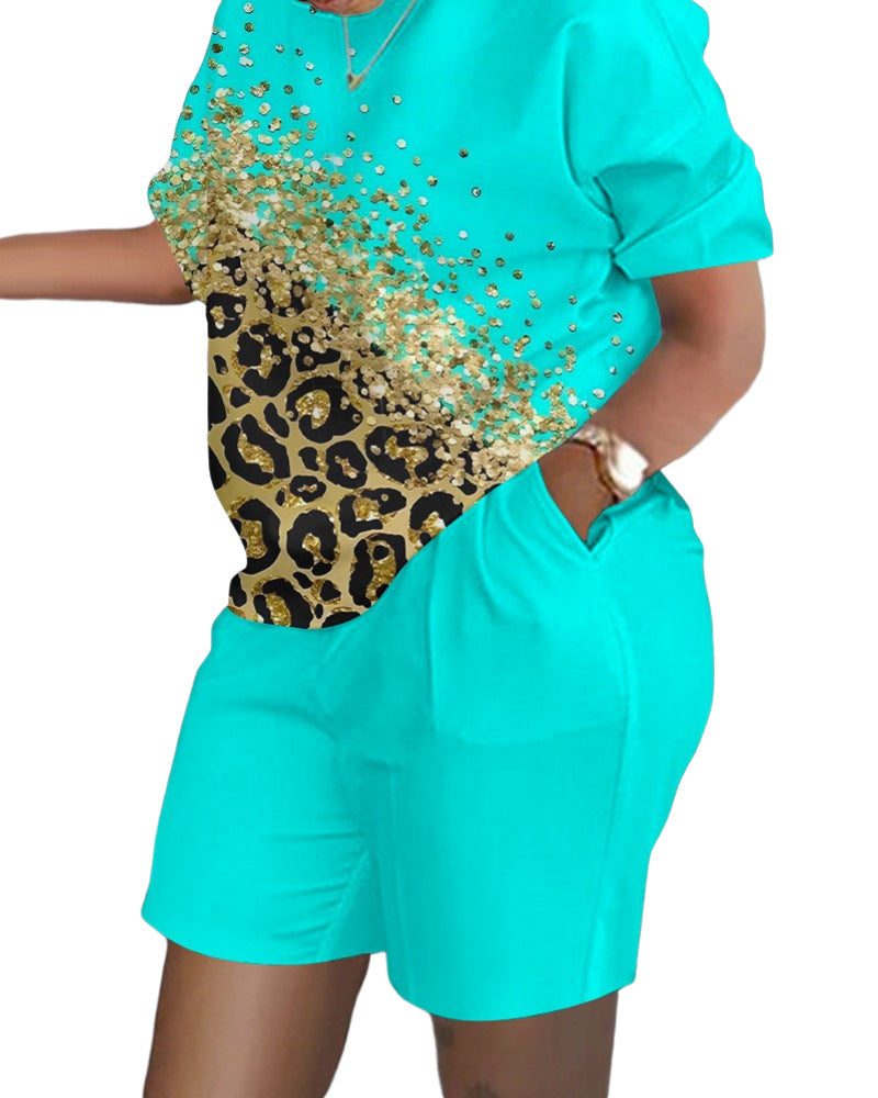 Conjunto de dos piezas de top y pantalones cortos de manga corta con cuello redondo y estampado gráfico informal para mujer