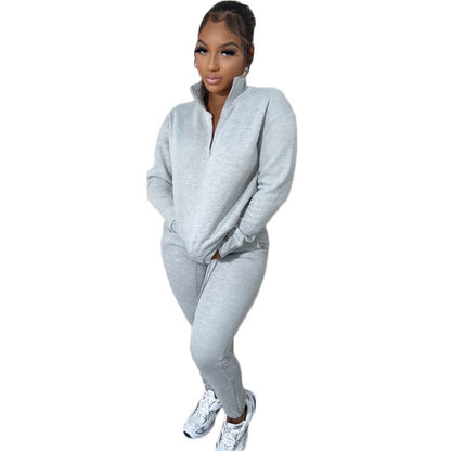 Conjunto deportivo informal de dos piezas para mujer, sudadera y pantalones de manga larga con cremallera y cuello alto en color liso