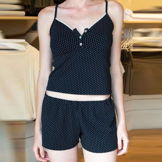 Conjunto de dos piezas de camisola corta, pantalones cortos y top de color liso informal a la moda para mujer