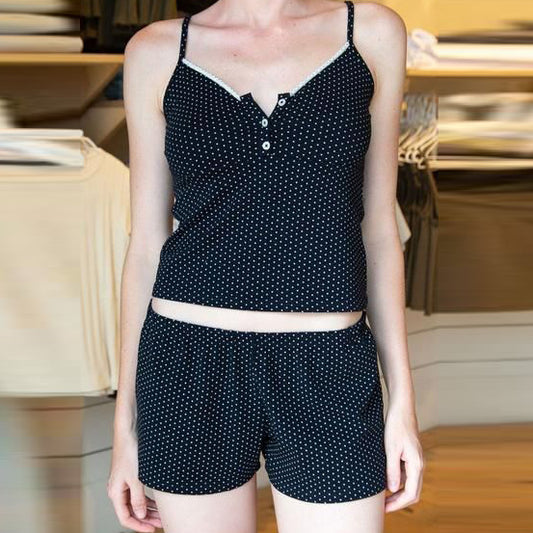 Conjunto de dos piezas de camisola corta, pantalones cortos y top de color liso informal a la moda para mujer