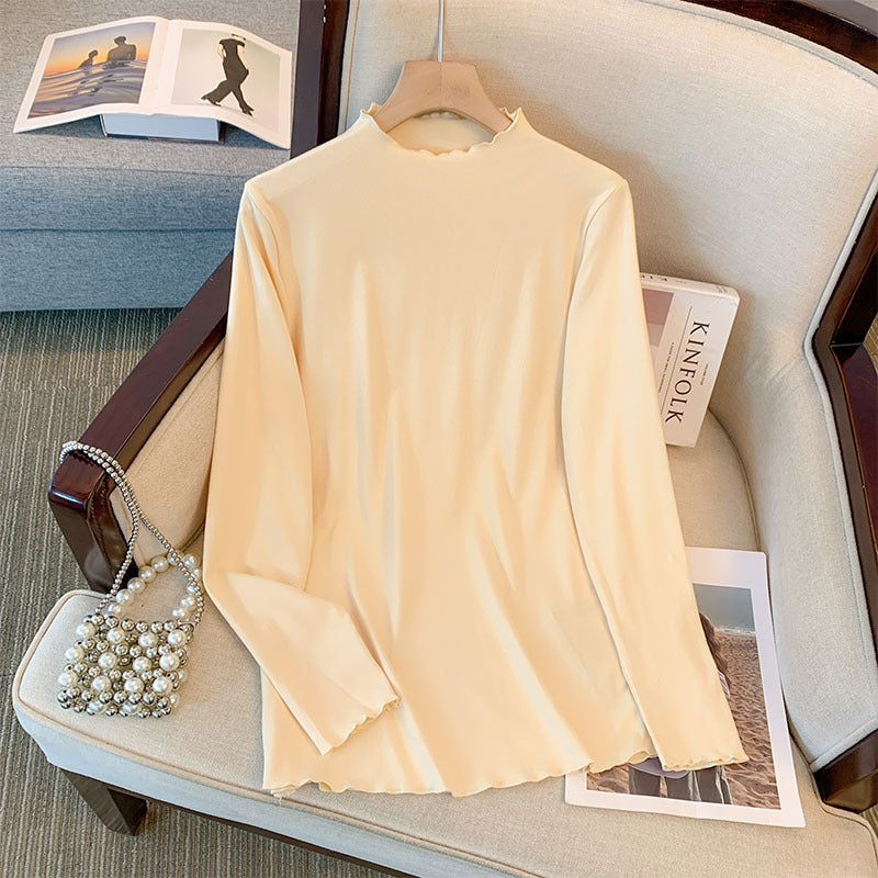 Camiseta básica informal holgada de talla grande con cuello alto y manga larga en color liso para mujer