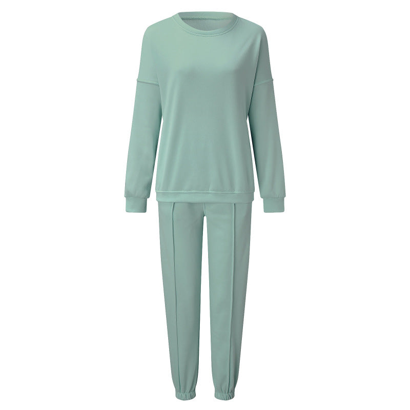 Conjunto de dos piezas holgado e informal con top y pantalón de manga larga y cuello redondo de color liso para mujer