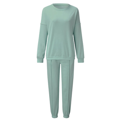 Conjunto de dos piezas holgado e informal con top y pantalón de manga larga y cuello redondo de color liso para mujer