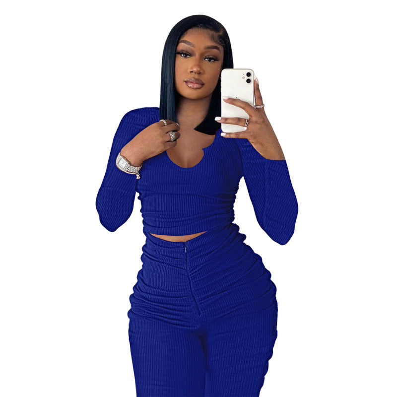 Conjunto deportivo de dos piezas para mujer: top de manga larga con cuello en U y pantalón plisado